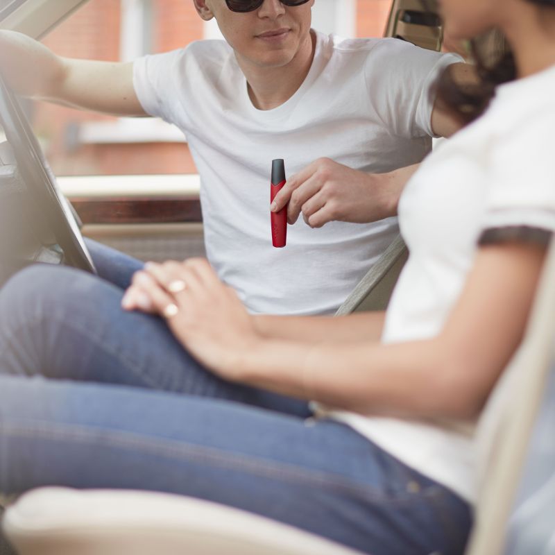Young Man Using ePen 3 in Car Young Man Using ePen 3 in Car